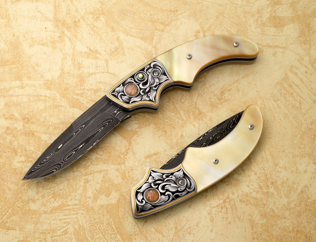 Engraved gold mother of pearl button lock folding knife