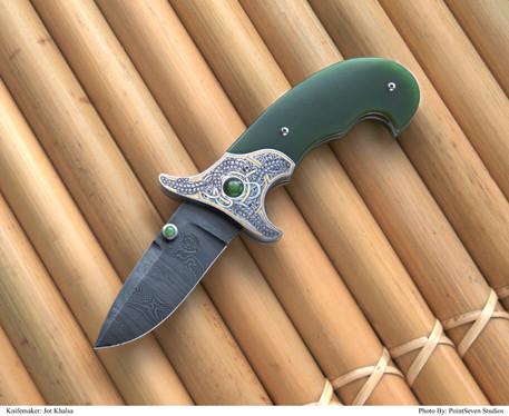 Engraved jade folding knife