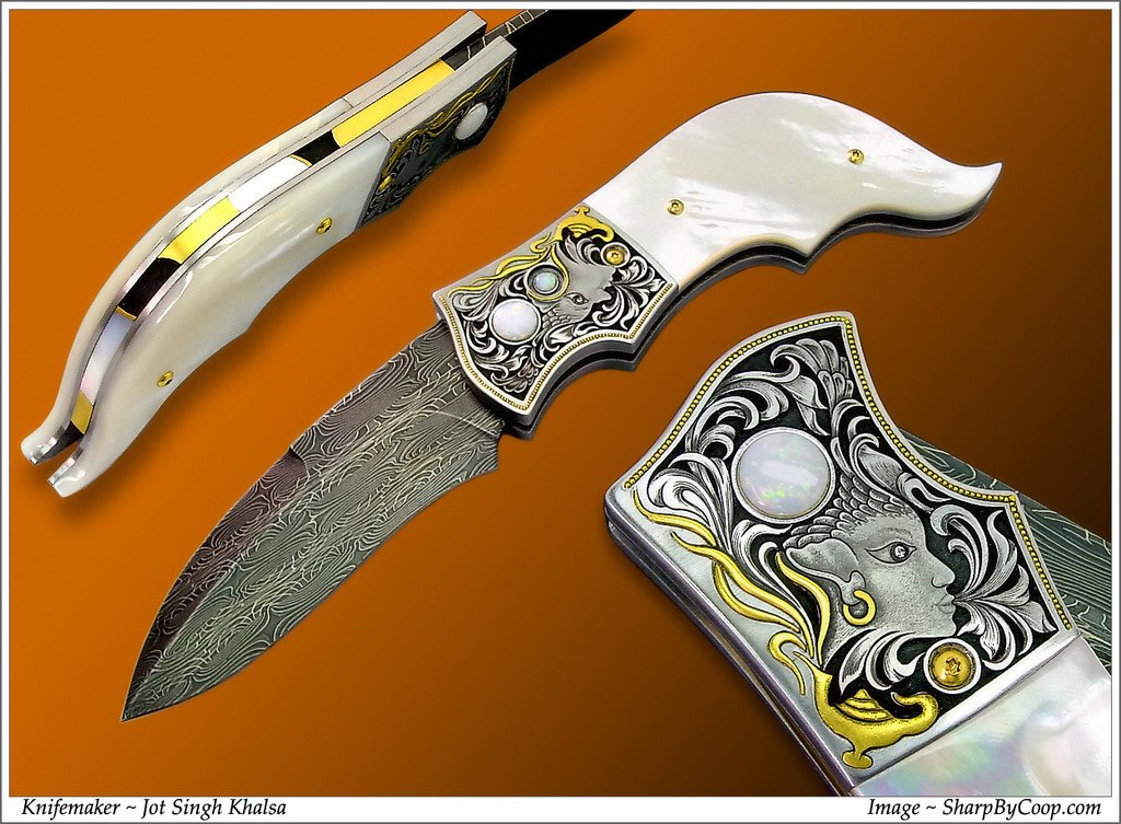 Mother of pearl handled button lock folding knife