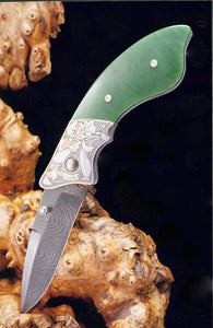 Engraved jade folding knife