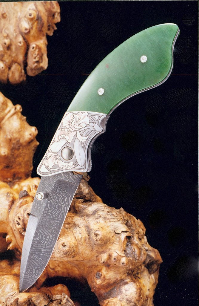 Engraved jade folding knife