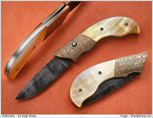 Gold mother of pearl folding knife