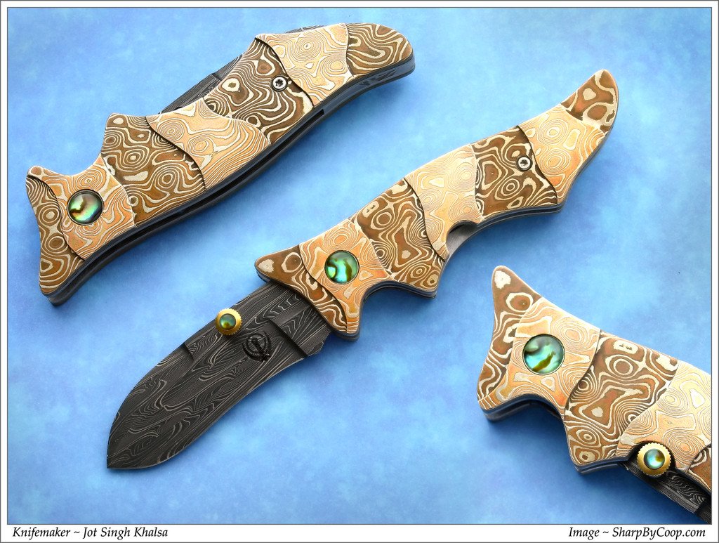 Carved mokume folding knife