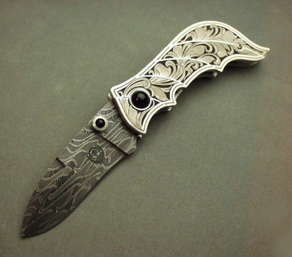 Engraved carved silver folding knife